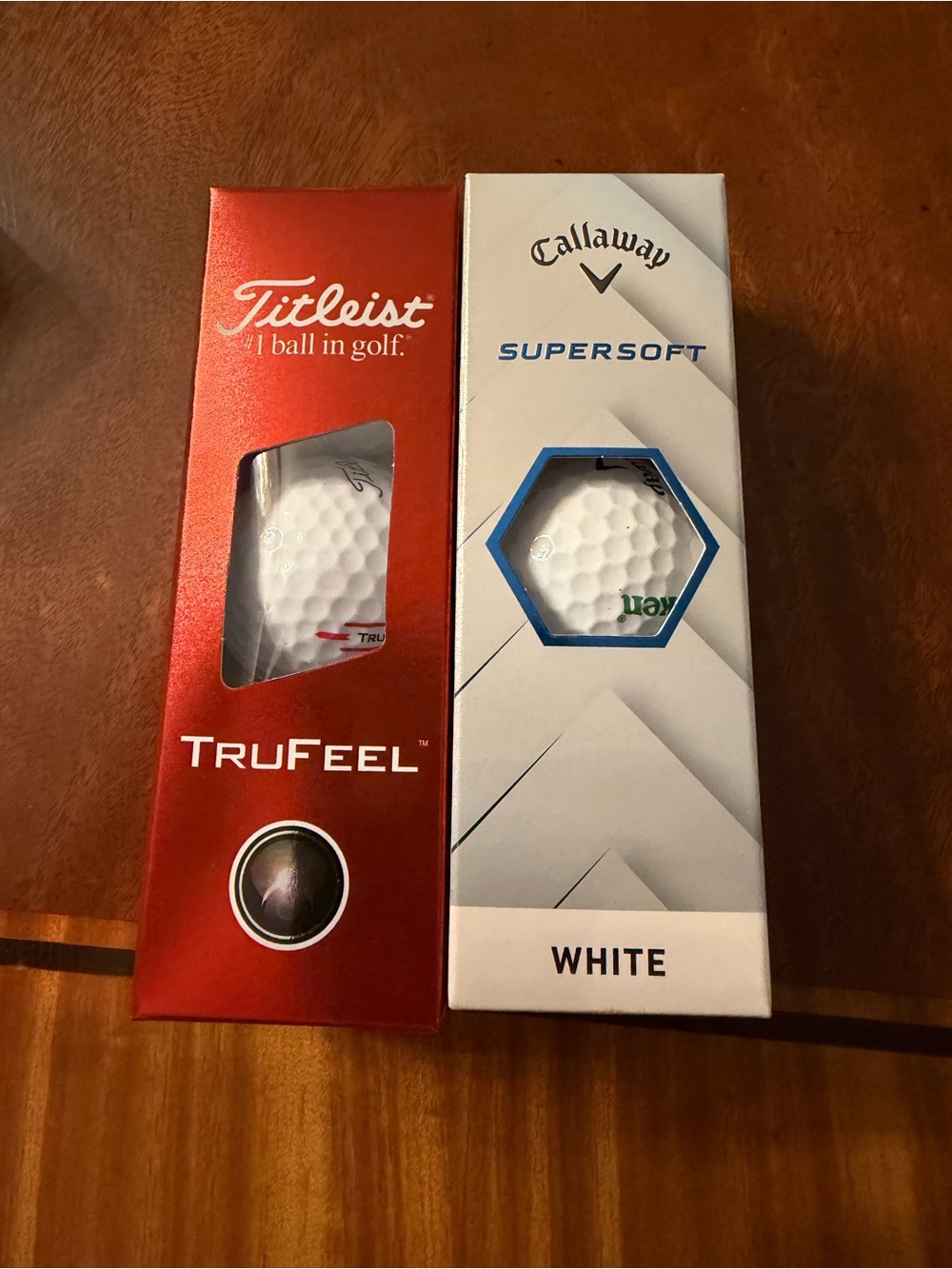 Two packs of new golf balls Titleist and Callaway